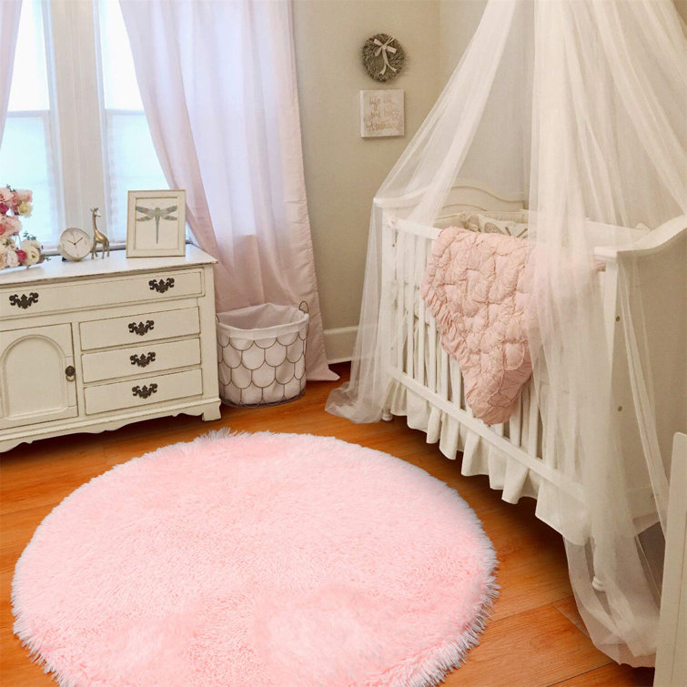 Round pink store rug for nursery